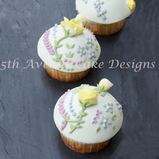 Learn how to pie a rose and flowers with royal icing directly on a cupcake with ease