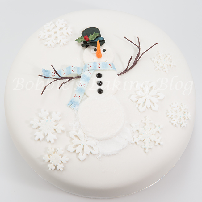 Learn how to create alan dunn's sugar snowman cake 