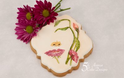 5ᵗʰ Avenue’s Surreal Floral Face Cookie using Negative Space 🌸🌺💐